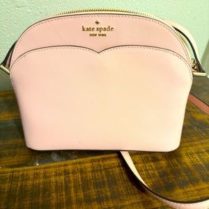 A beautiful pink Kate Spade crossover purse.
